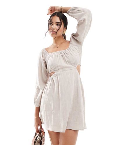 Robe patineuse courte à encolure Bardot avec manches volumineuses et découpe - Écru - Pimkie - Modalova