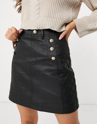 Mini-jupe imitation cuir matelassée - River Island - Modalova