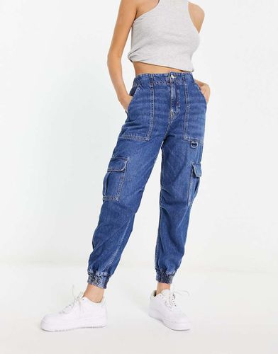 Jean cargo avec poches - denim - River Island - Modalova