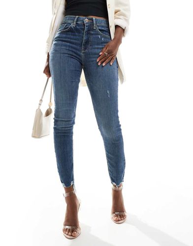 Jean skinny taille haute - délavé moyen - River Island - Modalova