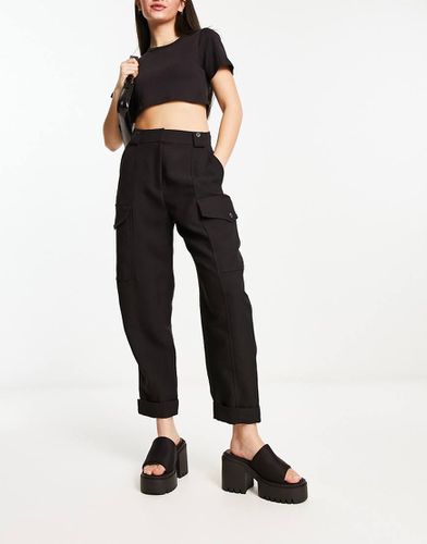 Pantalon fonctionnel coupe carotte - River Island - Modalova