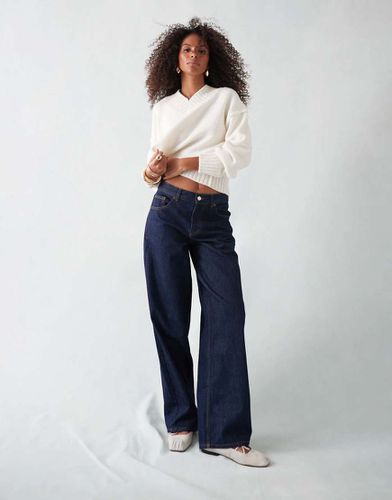 Jean à taille basse cintrée à l'arrière - Indigo brut - Topshop - Modalova