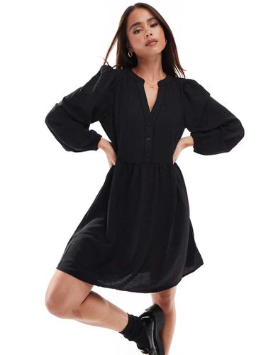 Robe babydoll courte à col V et à manches bouffantes - Vero Moda - Modalova