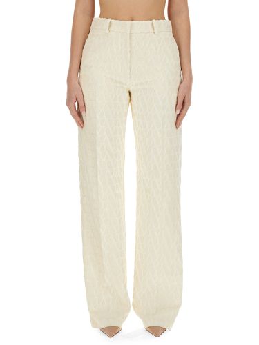 Pants with "toile iconographe" pattern - valentino - Modalova