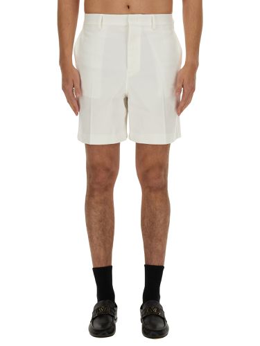 Bermuda shorts with rubberized v detail - valentino - Modalova