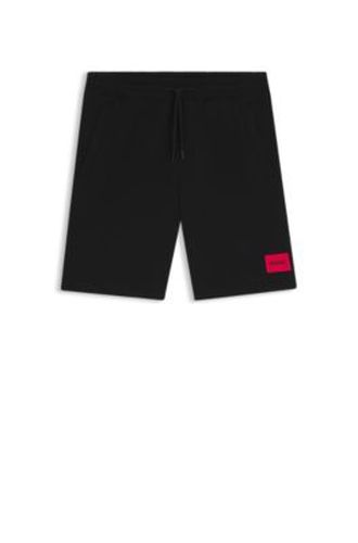 Short en molleton de coton avec étiquette logo rouge - HUGO - Modalova