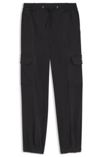 Pantalon cargo Relaxed en coton stretch - HUGO - Modalova