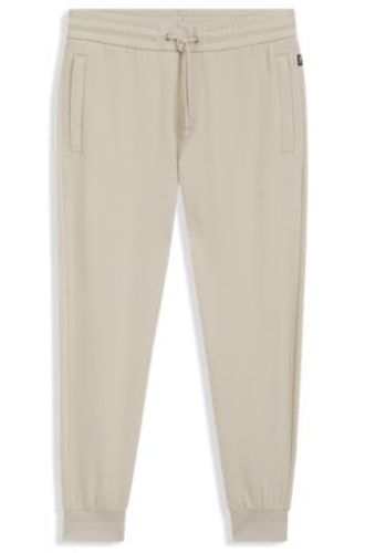 Pantalon de survêtement en coton stretch avec bas de jambes resserrés - Boss - Modalova