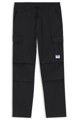 Pantalon coupe décontractée en tissu ripstop - HUGO - Modalova