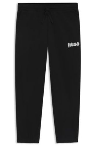 Bas de survêtement en molleton de coton avec logo imprimé - HUGO - Modalova