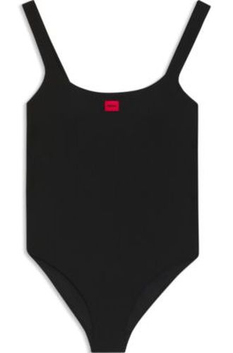 Maillot de bain côtelé avec étiquette logotée rouge - HUGO - Modalova