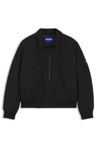 Veste déperlante avec poche zippée sur une manche - HUGO - Modalova