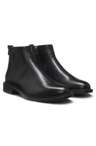 Bottes en cuir avec logo revisité - HUGO - Modalova