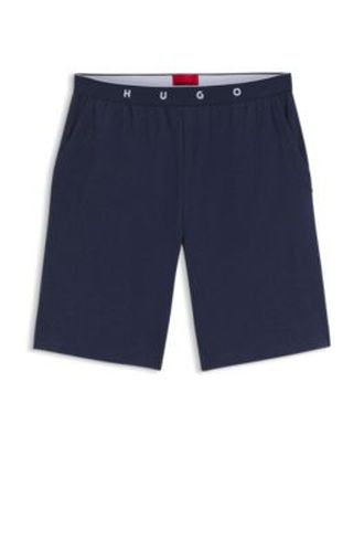 Bas de pyjama en coton mélangé à côtes et taille logotée - HUGO - Modalova