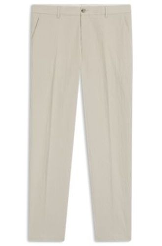 Pantalon coupe fuselée en seersucker de coton stretch - Boss - Modalova