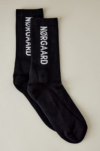 Chaussettes de sport à logo en Black chez Anthropologie - Mads Norgaard - Modalova