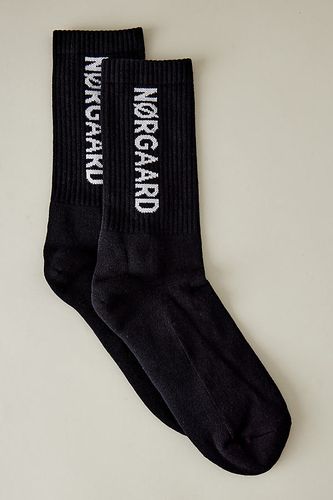 Chaussettes de sport à logo en Black, chez Anthropologie - Mads Norgaard - Modalova