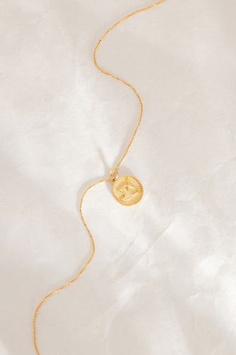 Collier plaqué or avec pendentif pièce à motif du zodiaque en Zodiac chez Anthropologie - Rachel Jackson - Modalova