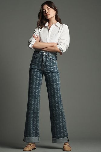 Le Jean Évasé Taille Haute Austyn par : Édition Imprimée en Blue, taille: 26 chez Anthropologie - Pilcro - Modalova