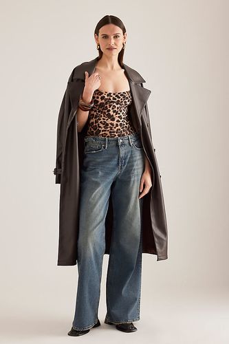 Jeans Relaxed Taille Mi-Haute Réglable Good Ease en Blue, taille: 25 chez Anthropologie - Good American - Modalova