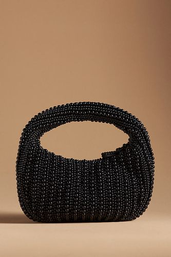 Petit sac à bandoulière orné de perles en Black chez - Anthropologie - Modalova