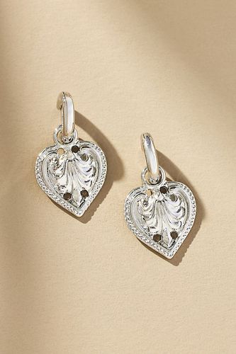 Western Heart Huggie Earrings par en Silver - By Anthropologie - Modalova