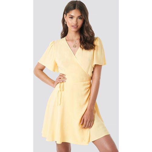 Wrap Mini Dress - Yellow - Camille Botten x NA-KD - Modalova