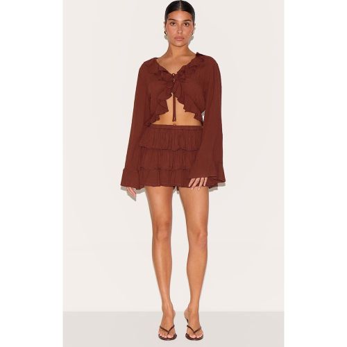 Petite Mini jupe-short en étamine à volants - PrettyLittleThing - Modalova