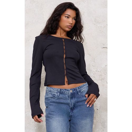 Top manches longues côtelé à agrafes et œillets - PrettyLittleThing - Modalova