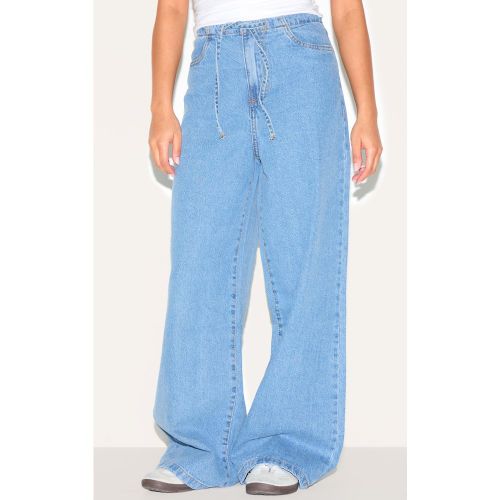 Petite Jean large à taille basse nouée - PrettyLittleThing - Modalova