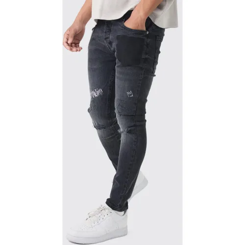 Jean skinny déchiré à imprimé graffiti - 30L - Boohooman - Modalova