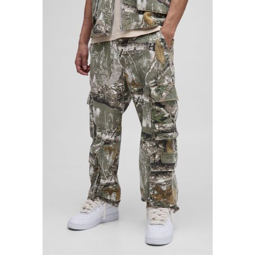 Pantalon cargo large à poches multiples et imprimé camouflage - 28R - Boohooman - Modalova
