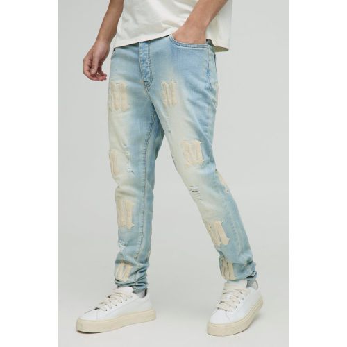 Jean skinny délavé à écussons - 28R - Boohooman - Modalova