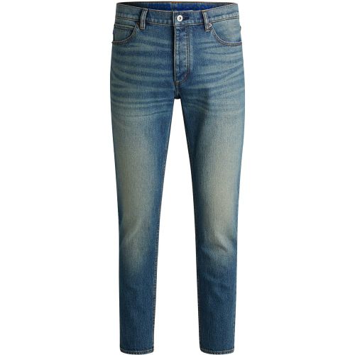 Jean fuselé en denim teinté bleu - HUGO - Modalova