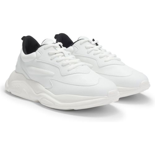 Baskets inspirées des chaussures de running avec détails contrastants - HUGO - Modalova