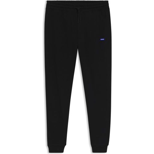 Bas de survêtement en molleton de coton avec patch logoté bleu - HUGO - Modalova