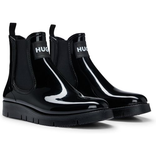 Bottines de pluie style Chelsea avec badge logoté et finition brillante - HUGO - Modalova