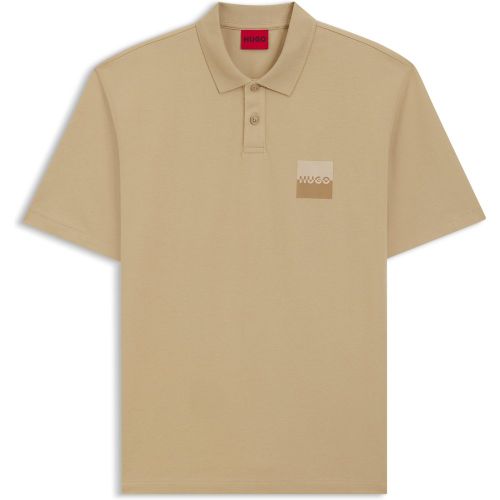 Polo Relaxed en coton avec logo revisité - HUGO - Modalova