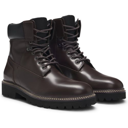 Bottines en cuir à bracelet matelassé et semelle crantée - HUGO - Modalova