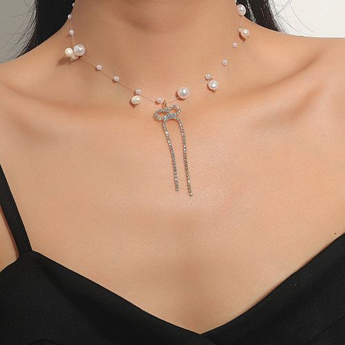 Collier avec nœud à fausse perle et zircone cubique - SHEIN - Modalova