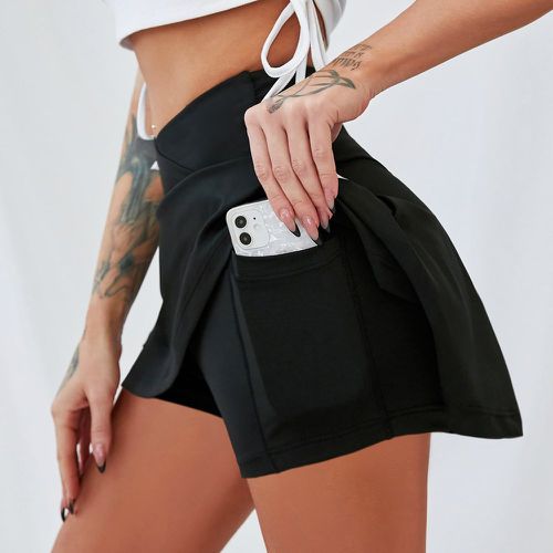 Jupe-short de sport taille asymétrique avec poche de téléphone - SHEIN - Modalova