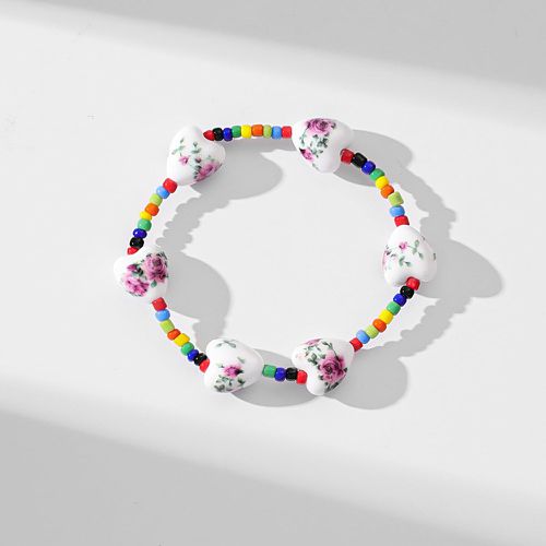 Bracelet perlé de couleur aléatoire fleuri à détail cœur - SHEIN - Modalova