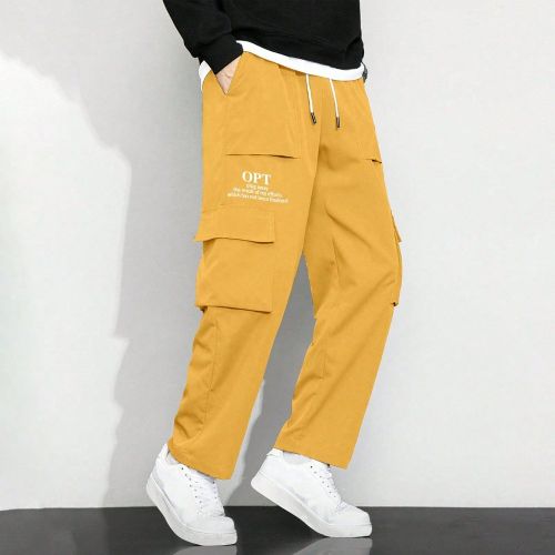 Pantalon cargos avec slogan graphique, poche rabattable, cordon de serrage à la taille - SHEIN - Modalova