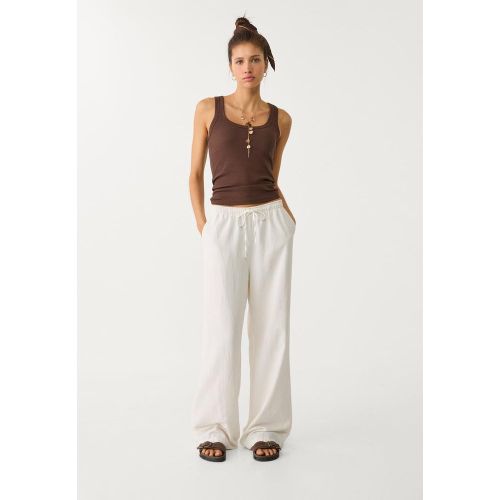 Pantalon fluide en lin Écru XS - Stradivarius - Modalova