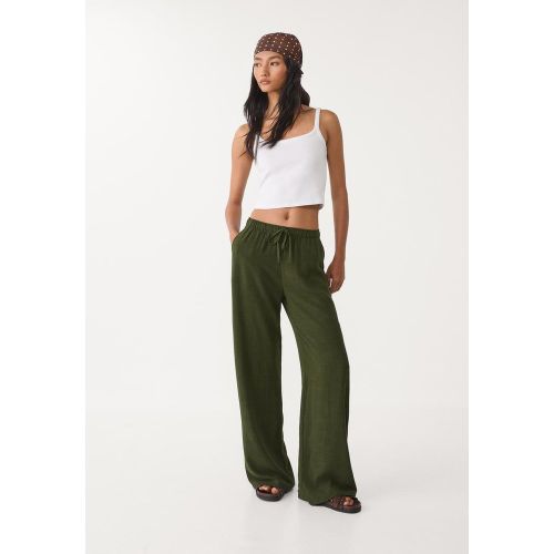 Pantalon fluide en lin XS - Stradivarius - Modalova