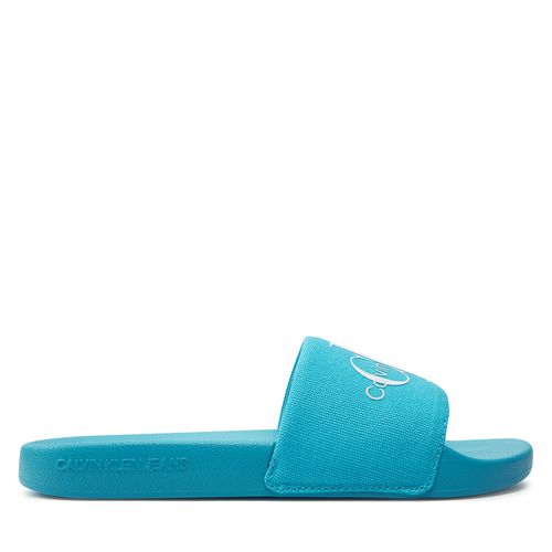Mules / sandales de bain Calvin Klein Jeans Slide Monogram Co YW0YW00103 Bleu - Chaussures.fr - Modalova