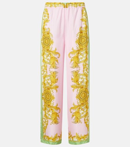 Pantalon ample imprimé en soie - Versace - Modalova