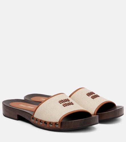 Miu Miu Mules à logo - Miu Miu - Modalova