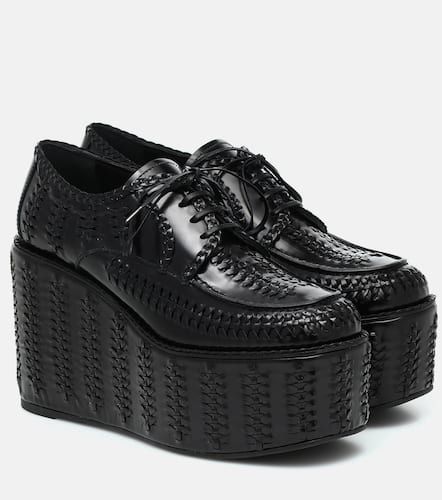 Prada Derbies compensées en cuir - Prada - Modalova