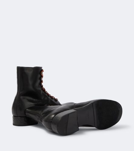 Prada Bottes à lacets en cuir - Prada - Modalova